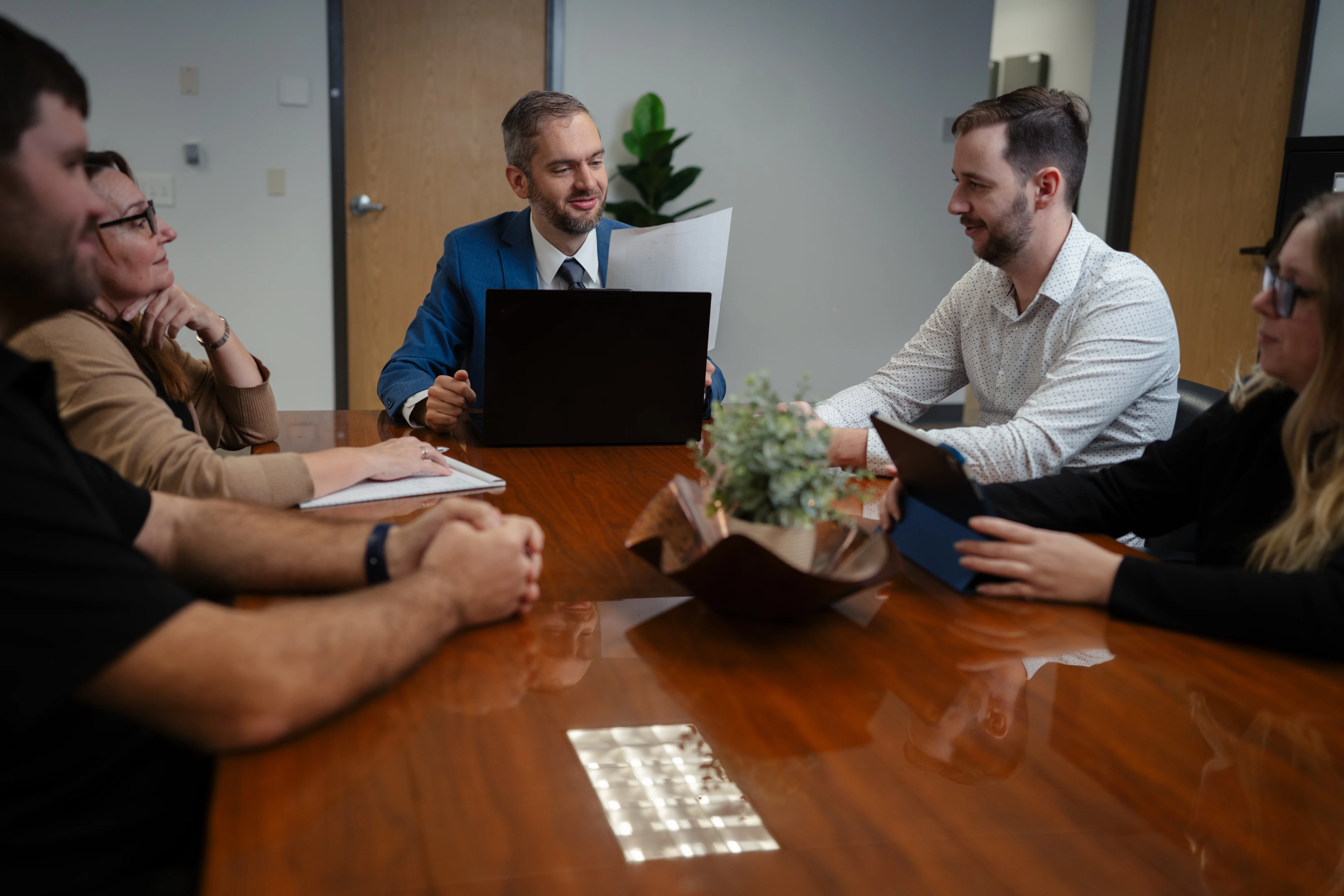 Team reviewing financial documents in a meeting